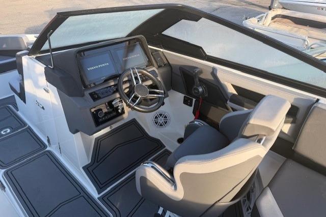 2023 Cobalt R6 Surf boat interior with modern dashboard and steering wheel.