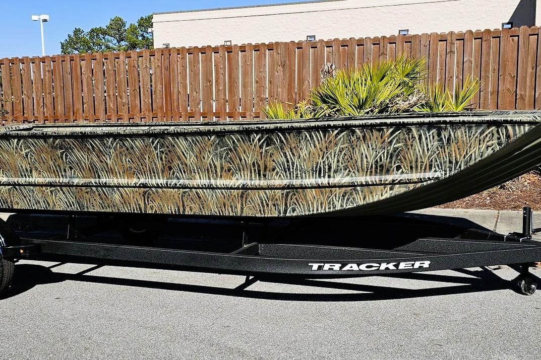 2026 Tracker Grizzly 2072 Utility boat with camouflage design on a trailer.