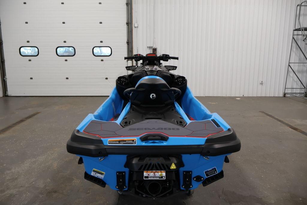 2026 Sea-Doo RXT-X 325 jet ski in a garage, rear view.