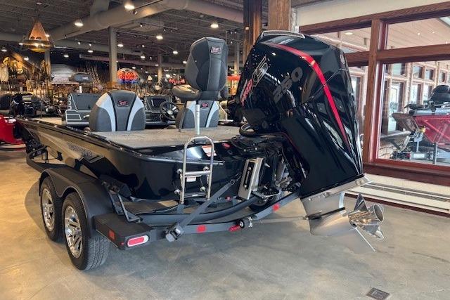 2025 Ranger ALPHA 208 boat in showroom, featuring sleek design and powerful engine.