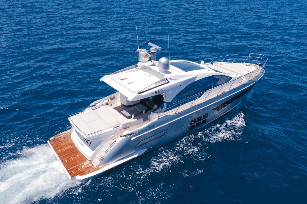 Aerial view of 2020 Azimut 60 yacht cruising on open blue sea.