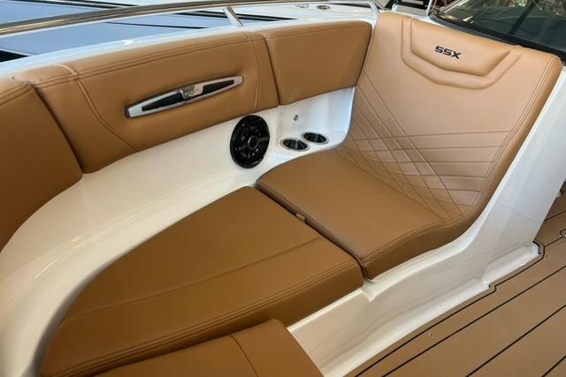 2025 Chaparral 247 SSX boat interior with tan leather seating and cup holders.