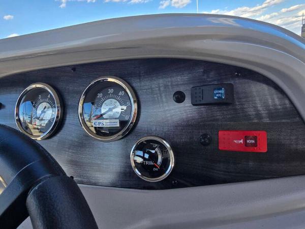 Dashboard of a 2025 Berkshire 20 CL boat with gauges and controls.