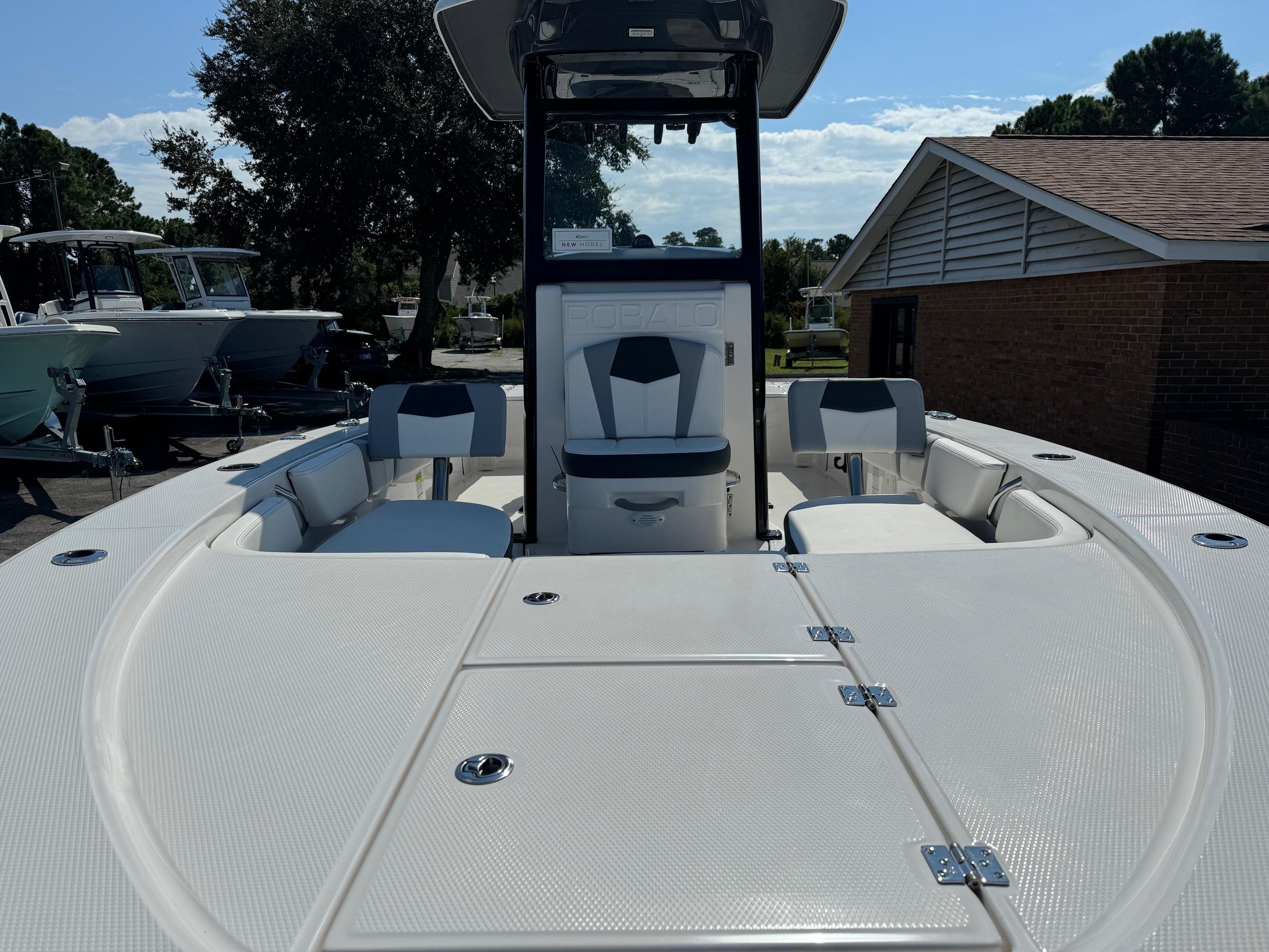 2025 Robalo R246 CAYMAN boat interior with seating and storage compartments.