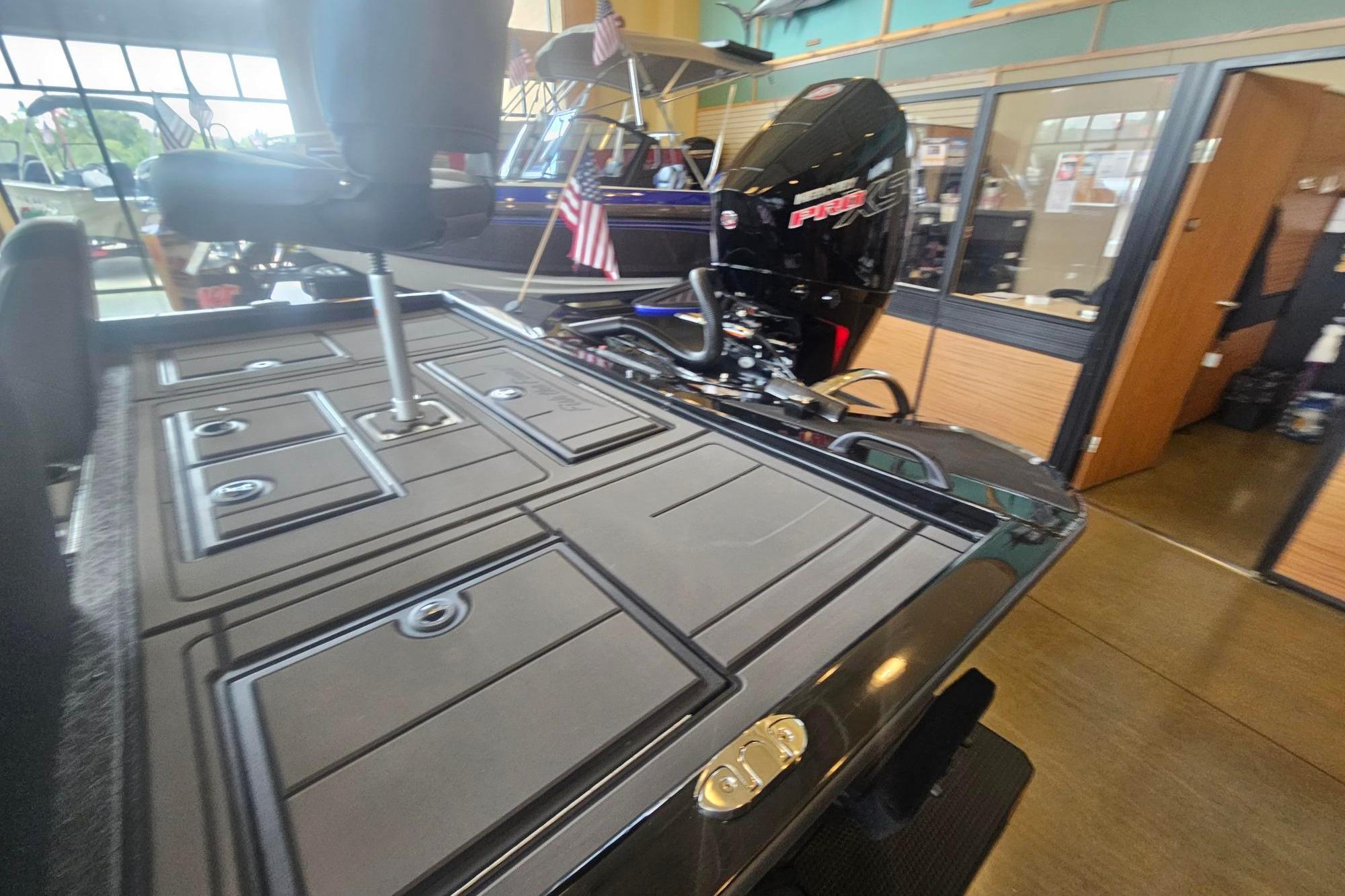 2026 Tracker Savage 215 boat interior with storage compartments and powerful engine.