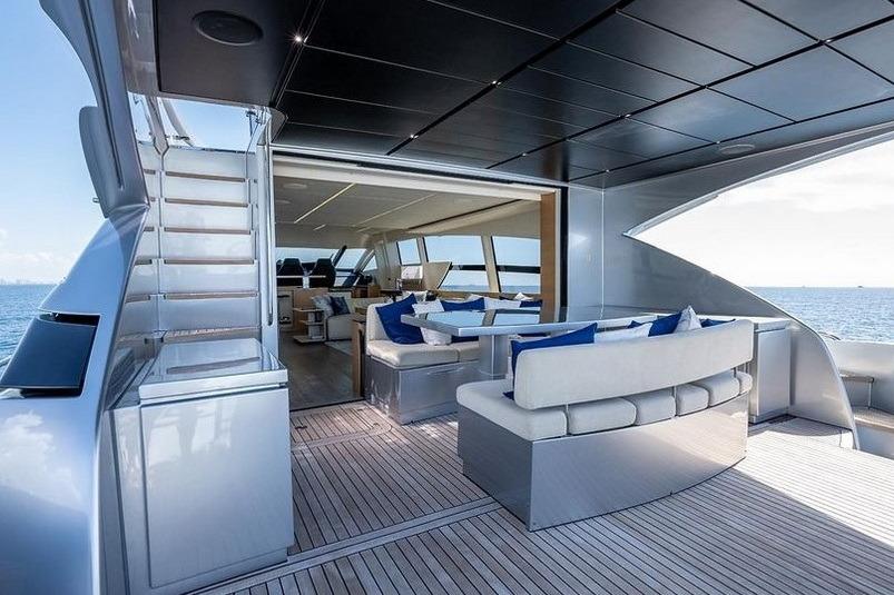 Luxurious 2015 Pershing 92 yacht interior with elegant seating and ocean view.