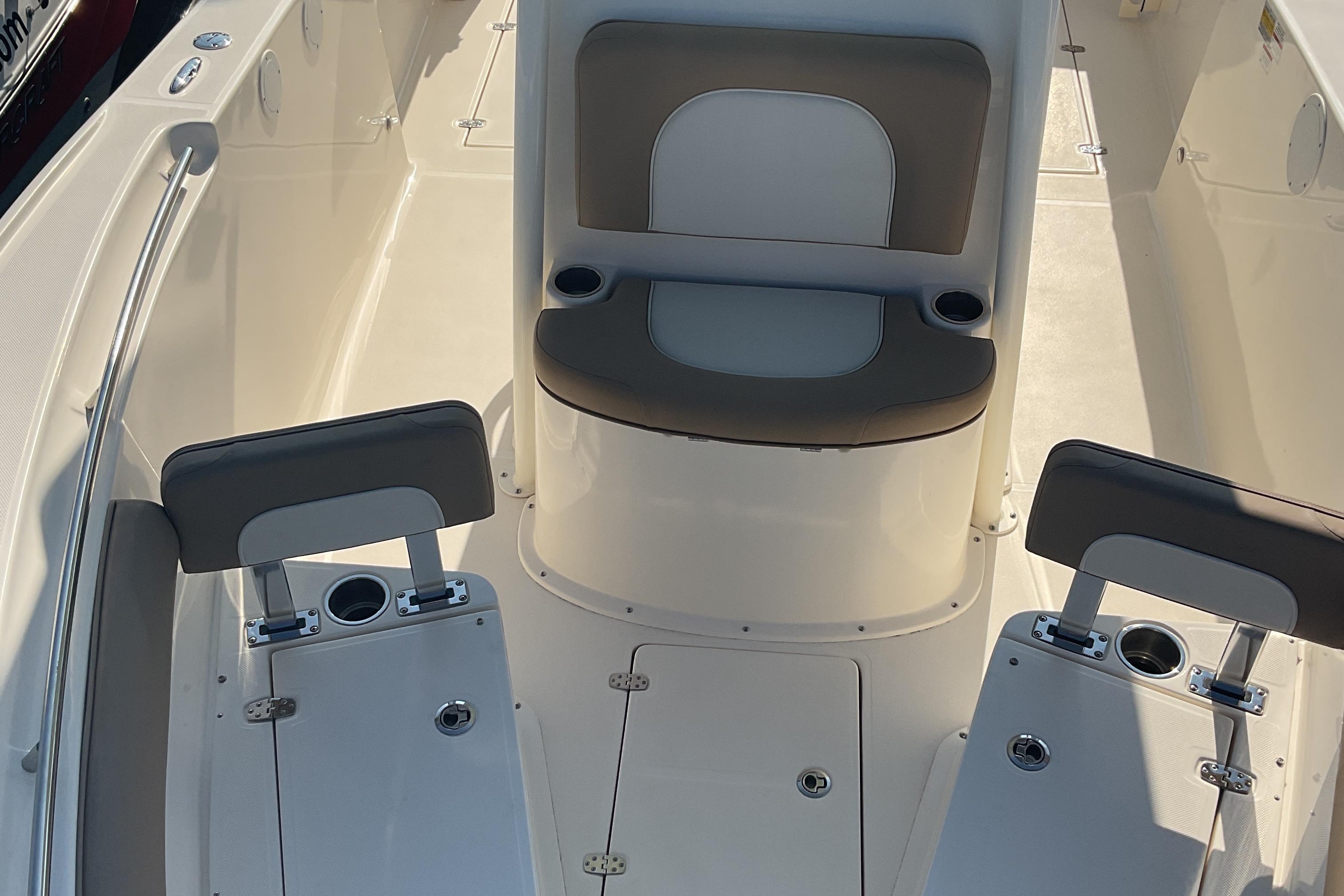 2023 Sea Born SX239 Offshore boat interior with seating and cup holders.