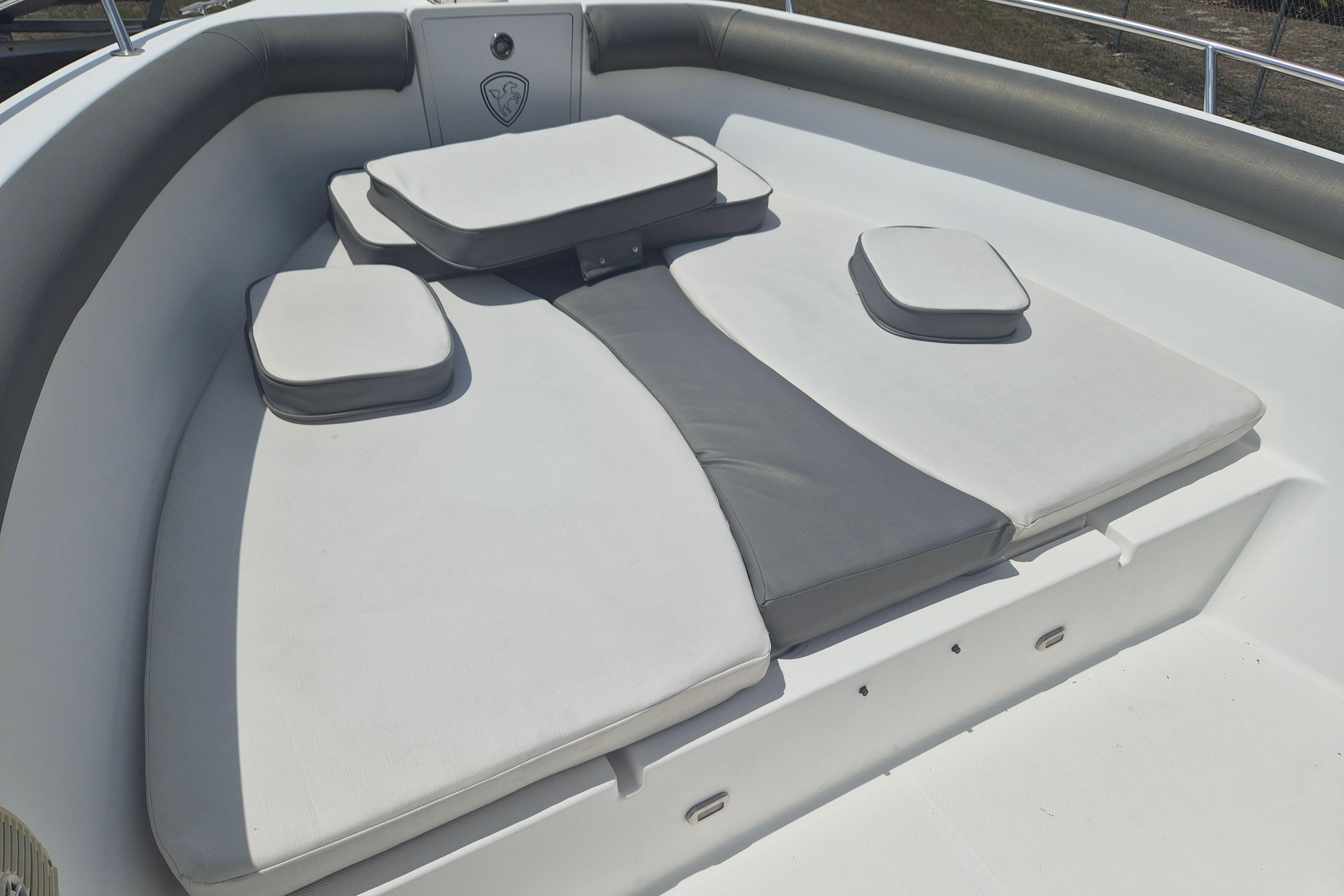 2006 Century 2900 Center Console boat with cushioned seating area.