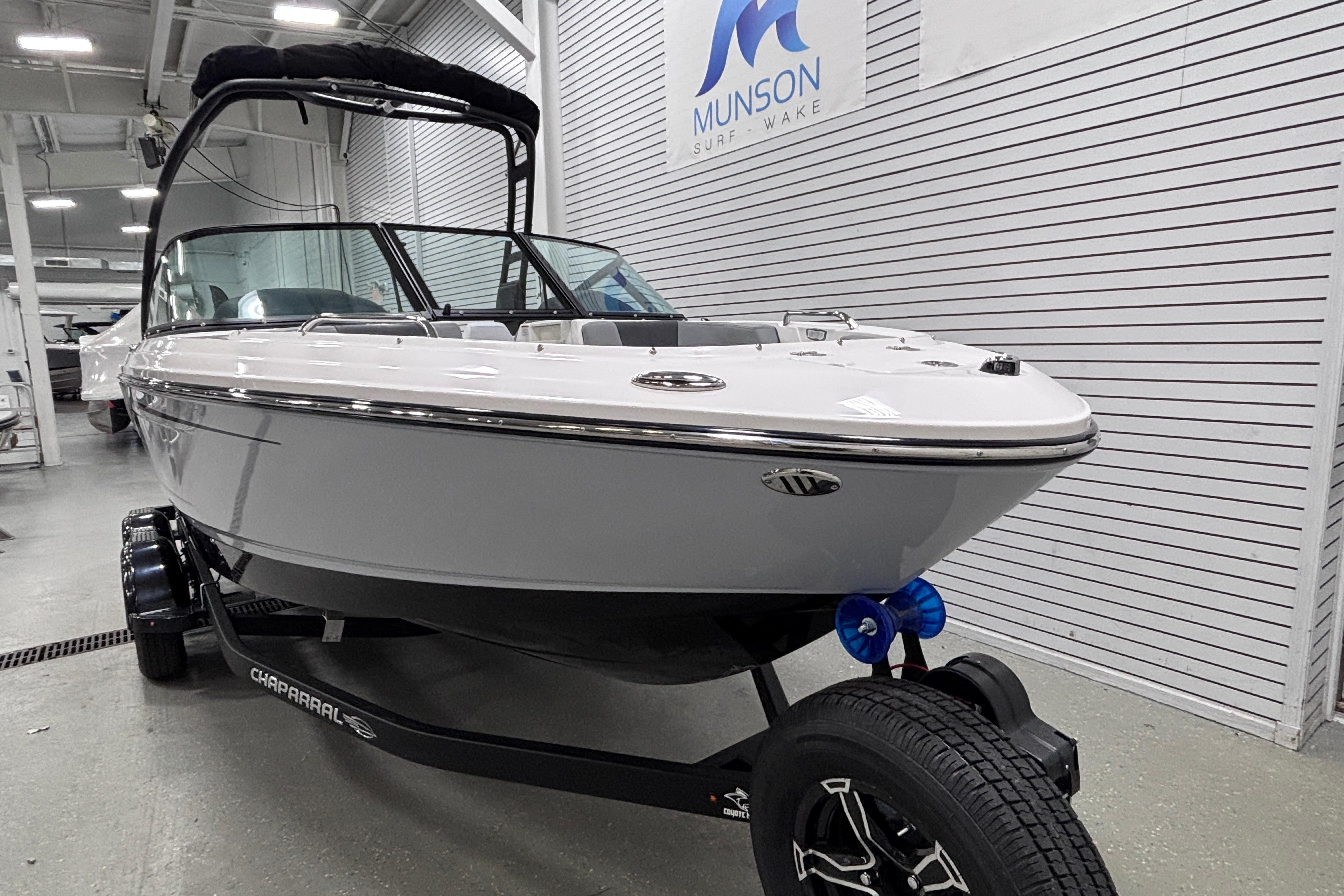 2026 Chaparral 21 SSi boat on trailer in showroom, Munson Surf Wake.
