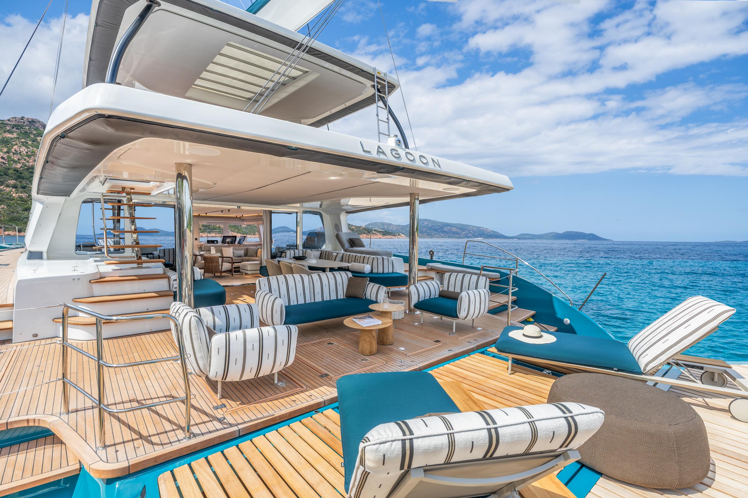 Luxurious 2025 Lagoon Eighty 2 yacht with elegant deck seating and stunning ocean views.