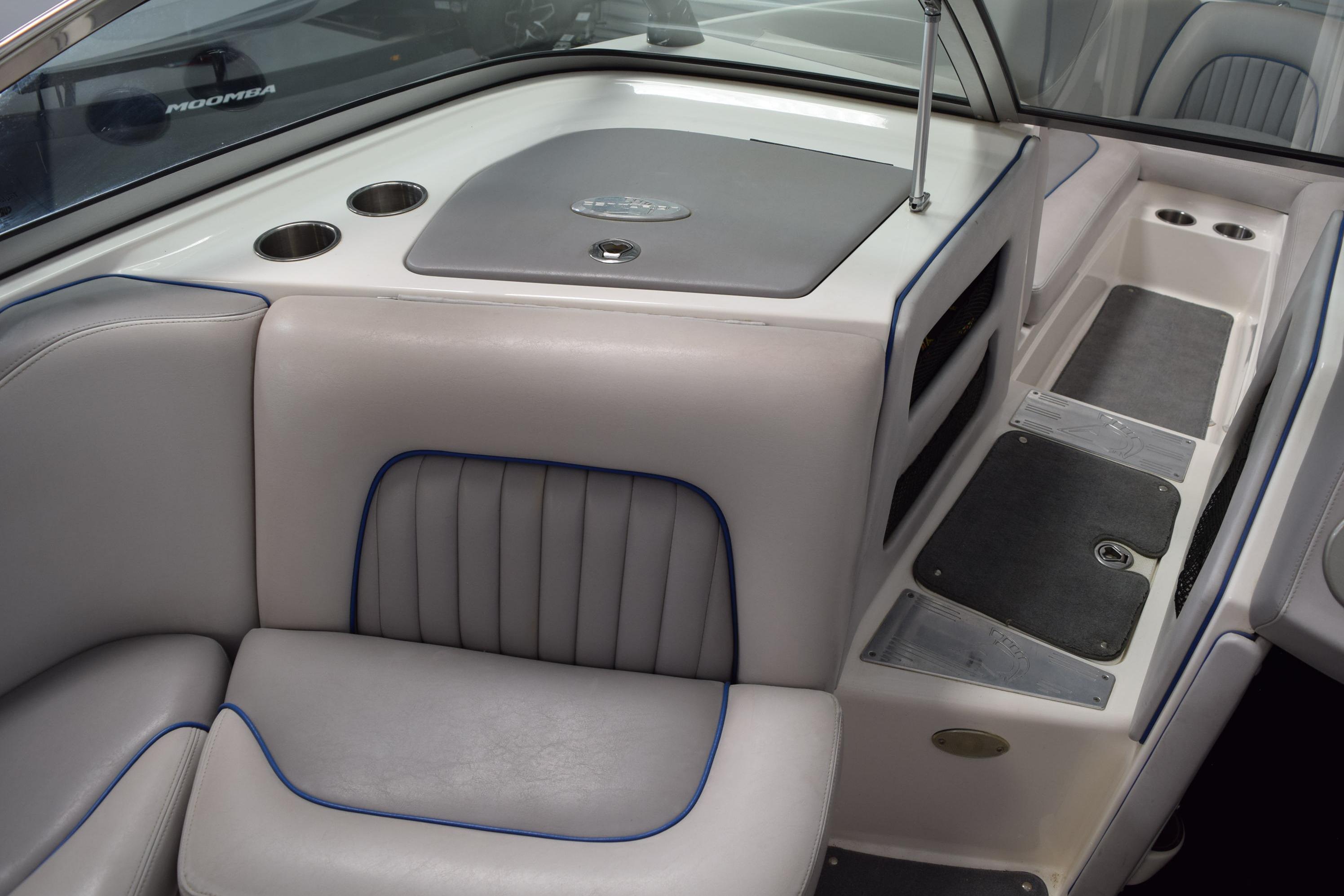 Interior of a 2007 Centurion SV 240 boat, featuring gray seating and cup holders.