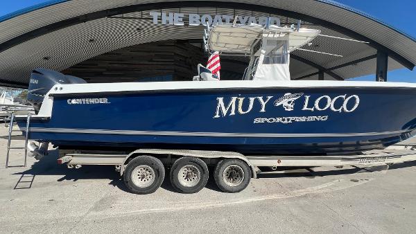 2005 Contender 36 Open boat on a trailer at a marina.