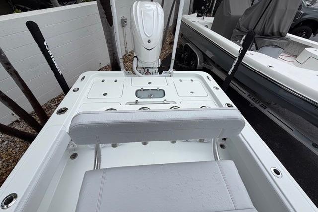 2025 Contender 26 Bay boat interior with seating and motor, showcasing modern design.