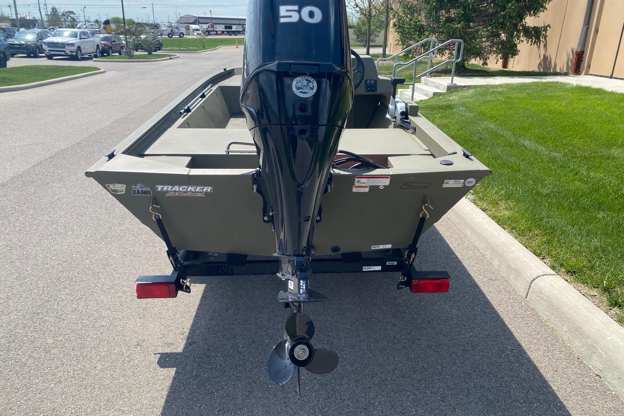 2026 Tracker Grizzly 1648 SC boat with outboard motor on a trailer.
