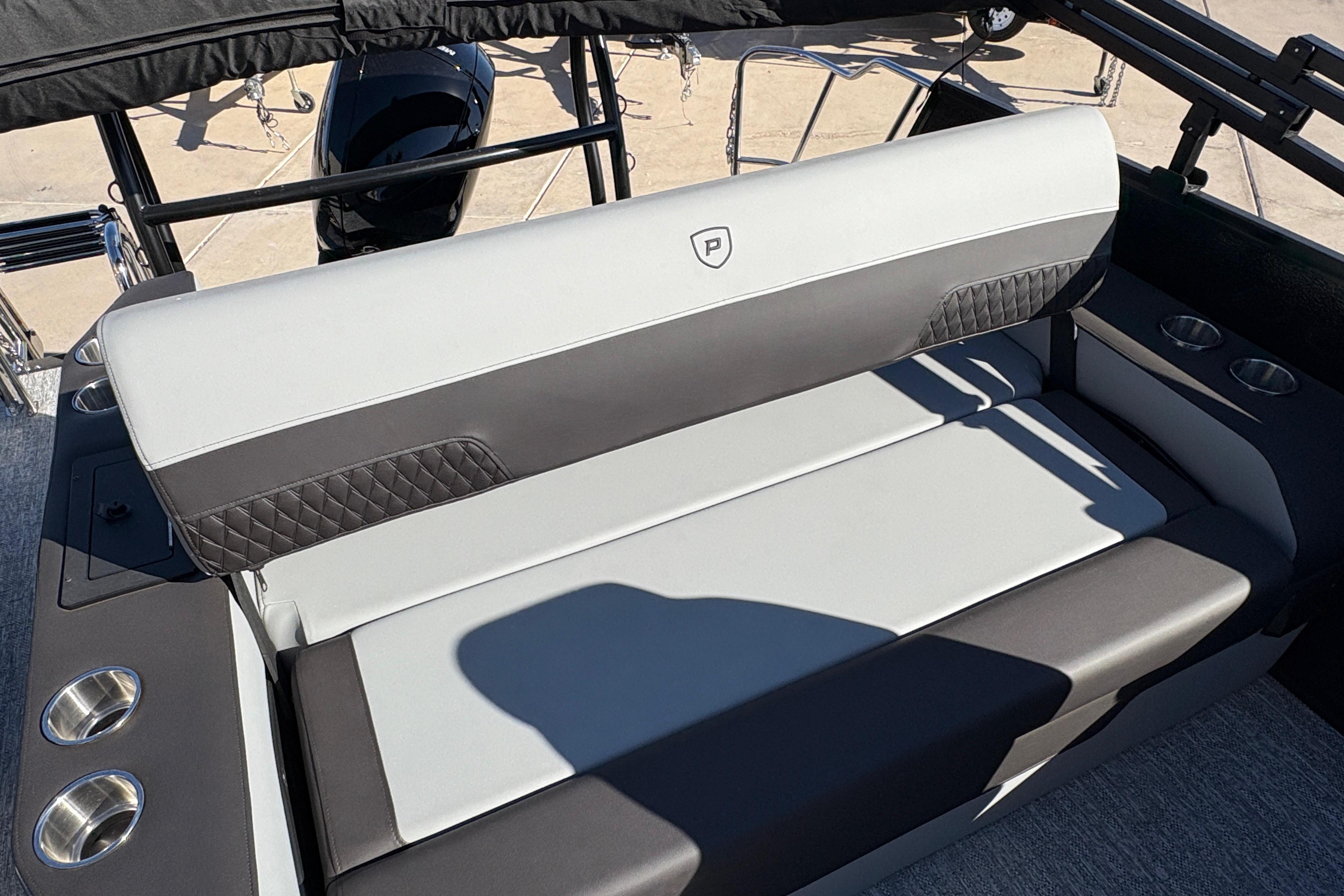 2026 Premier 210 Sunsation RL boat seating with cup holders and stylish upholstery.