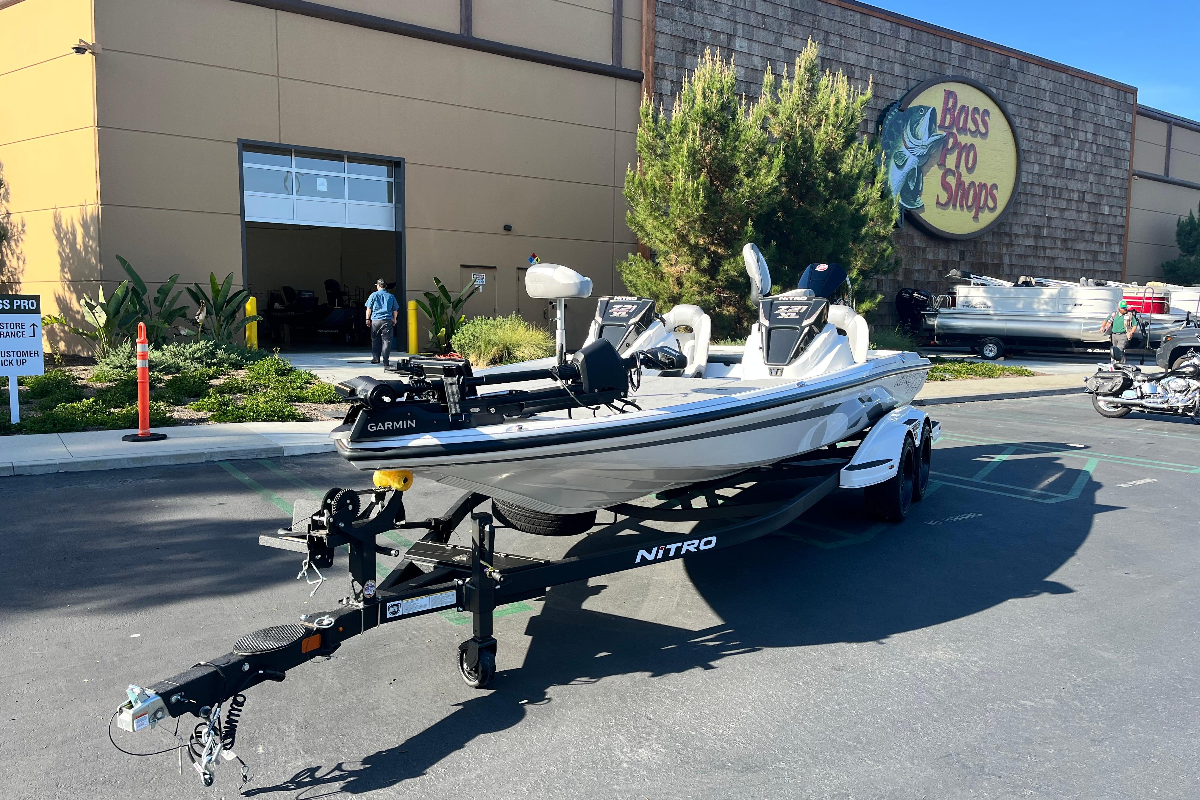 2026 Nitro Z21 XL Pro boat on trailer outside Bass Pro Shops.