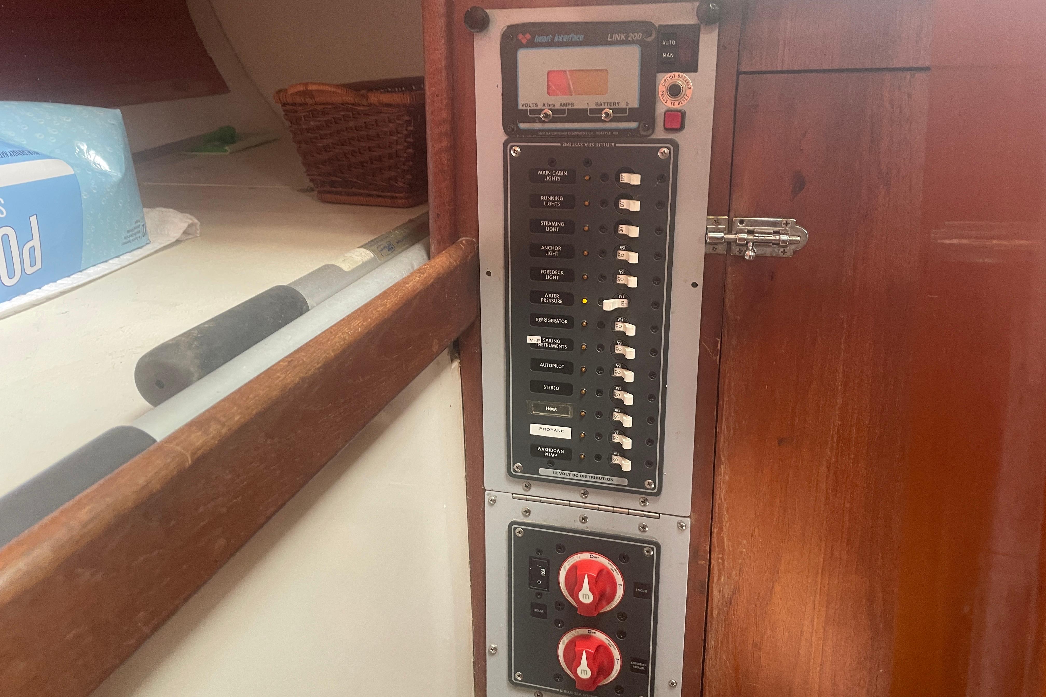 Electrical panel inside a 1981 Nonsuch 30 Classic sailboat, featuring switches and controls.