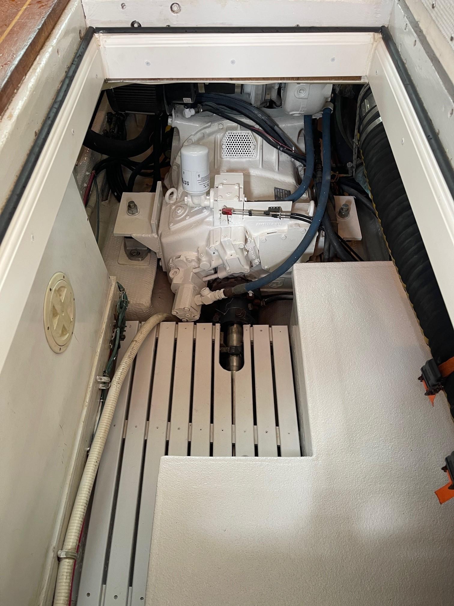 Engine compartment of a 1979 Jarvis Newman Trawler, showcasing mechanical components and wiring.