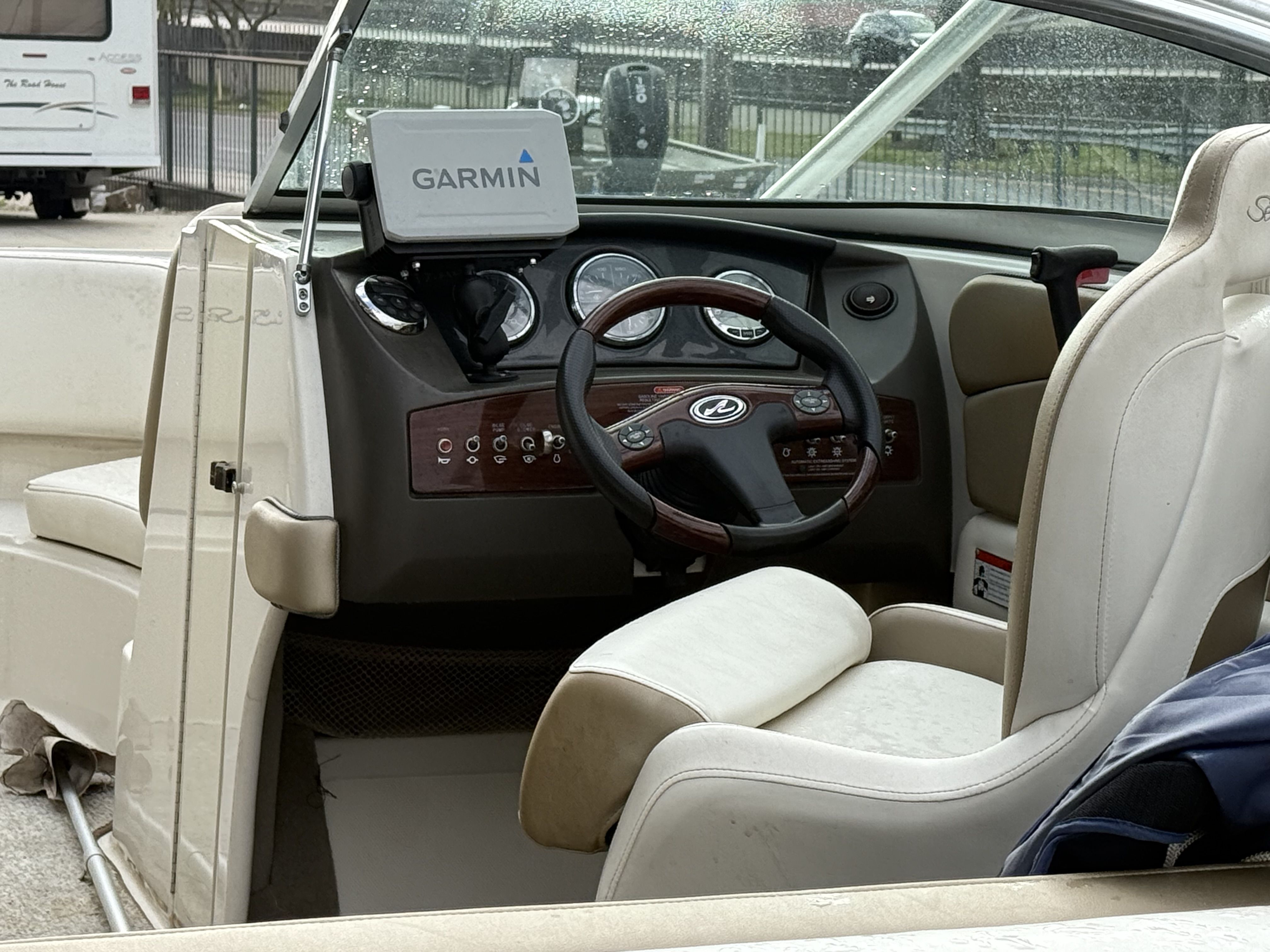 Interior of a 2007 Sea Ray 210 boat with Garmin navigation system.