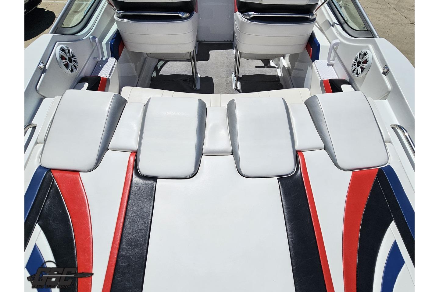 2005 Formula 271 FASTech boat interior with white, red, and blue seating and sleek design.
