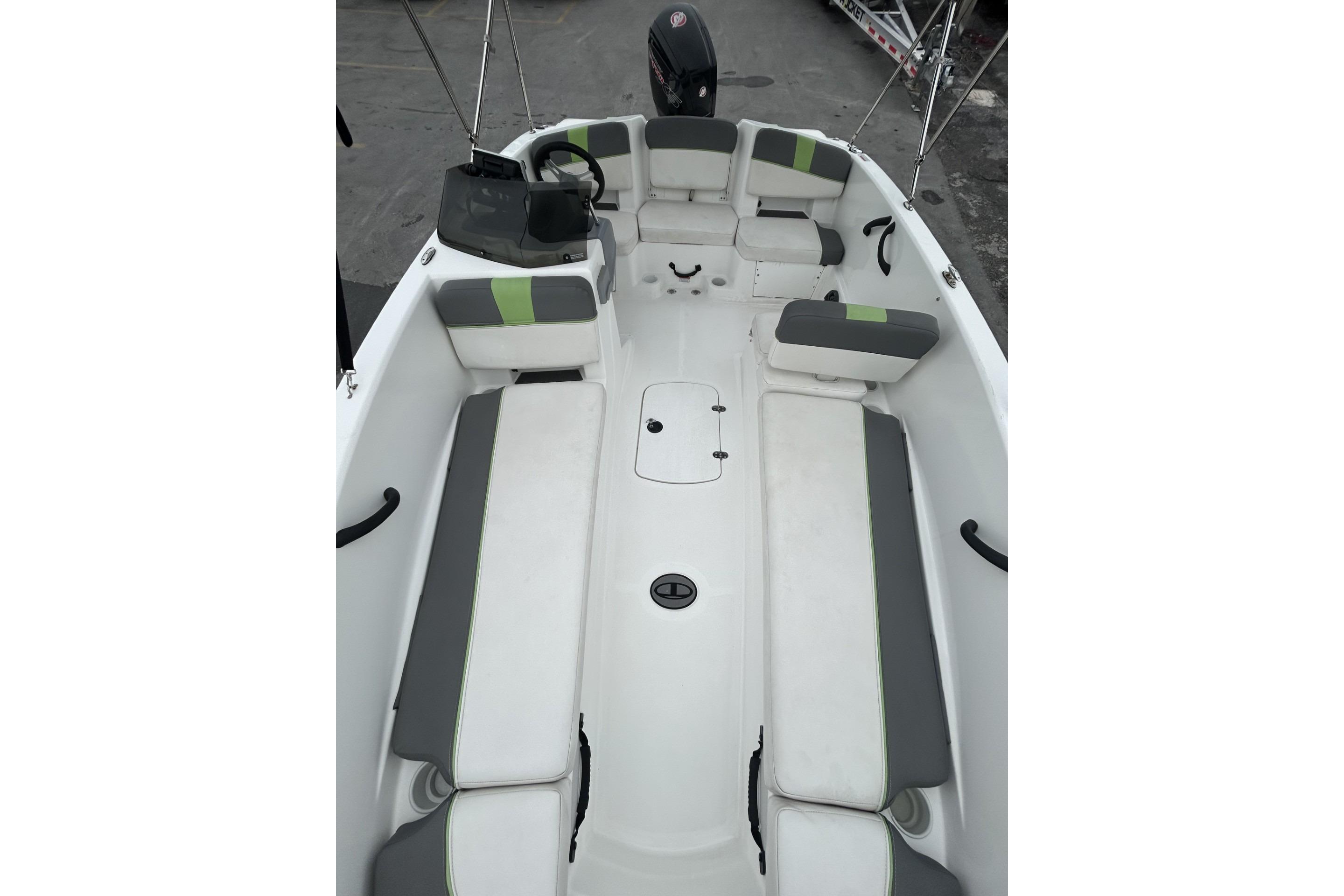 2022 Tahoe T18 boat interior with cushioned seating and steering console.