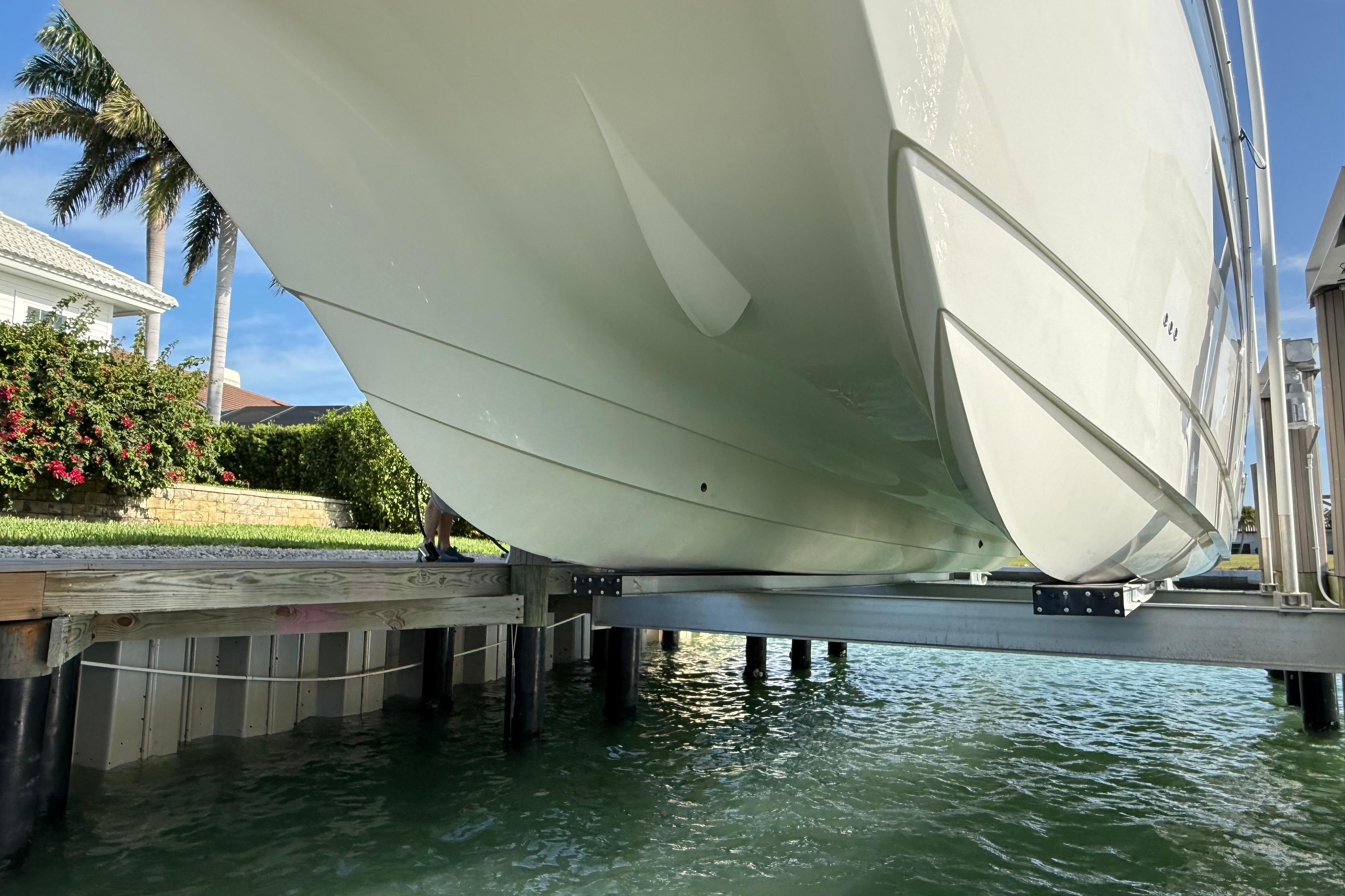 World Cat 400 DC-X boat on lift, showcasing sleek hull design, 2021 model.
