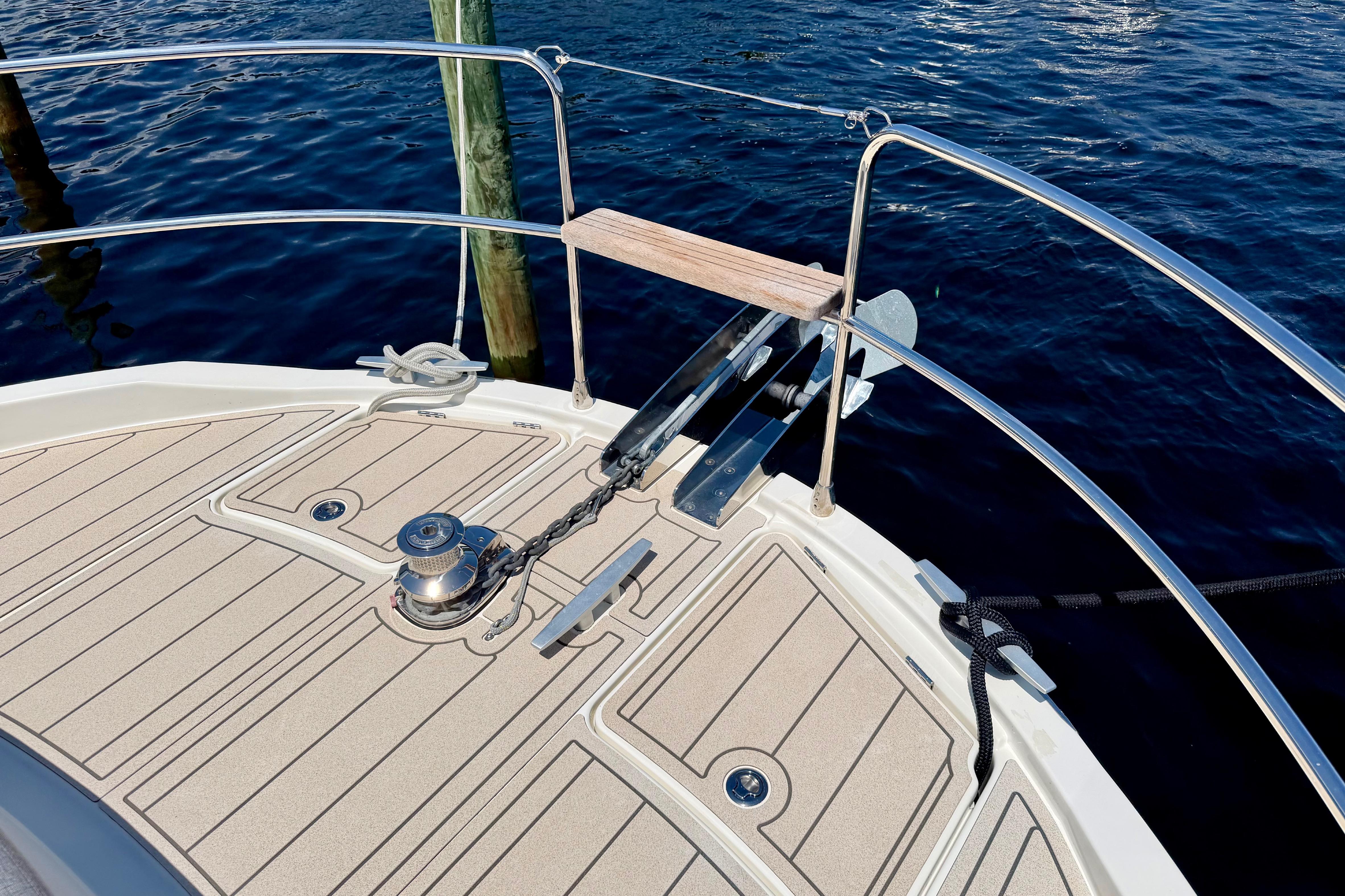 Bow deck of 2025 Beneteau Swift Trawler 41 Fly with anchor and winch.