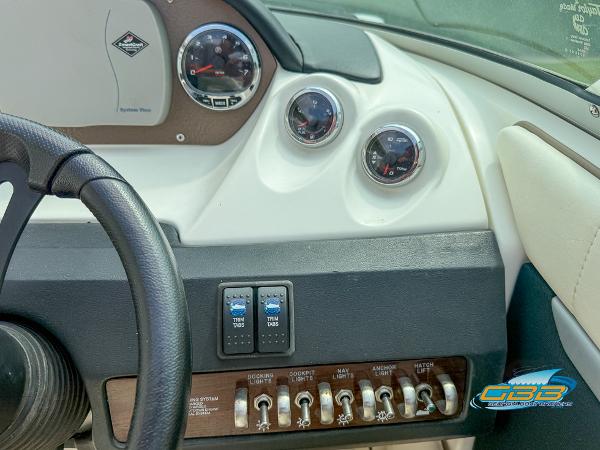 Dashboard of a 2008 Sea Ray 270 SLX boat with gauges and controls.