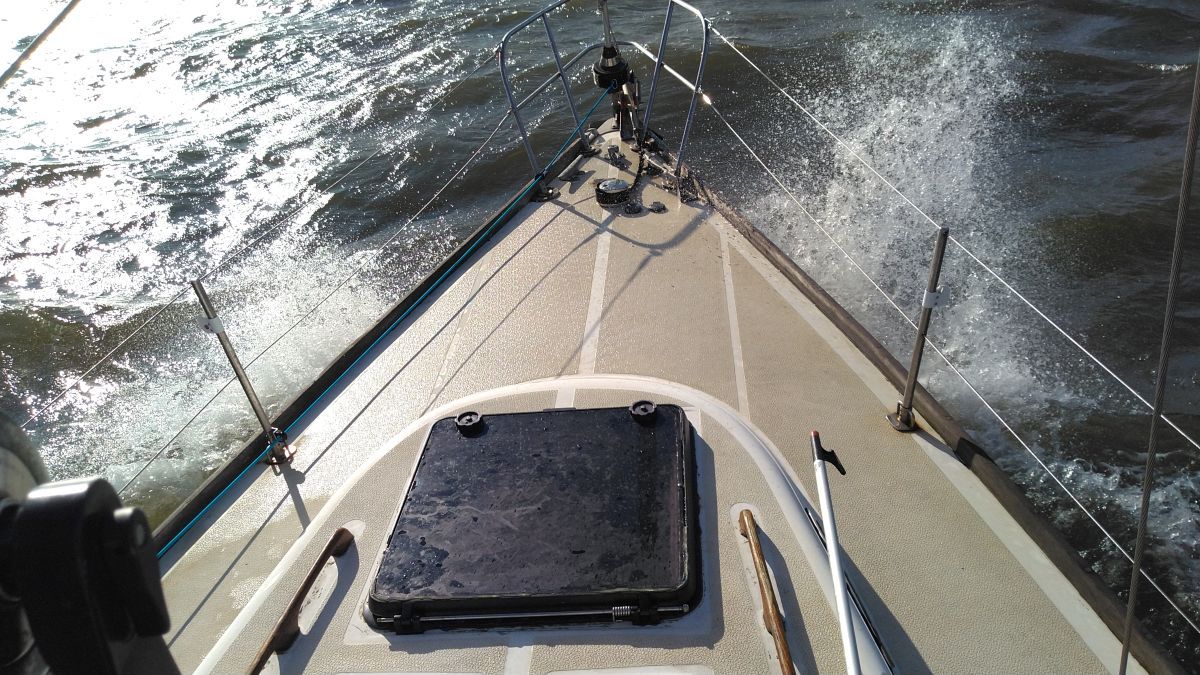Bow of a 1978 Tartan 37 sailboat on the water.