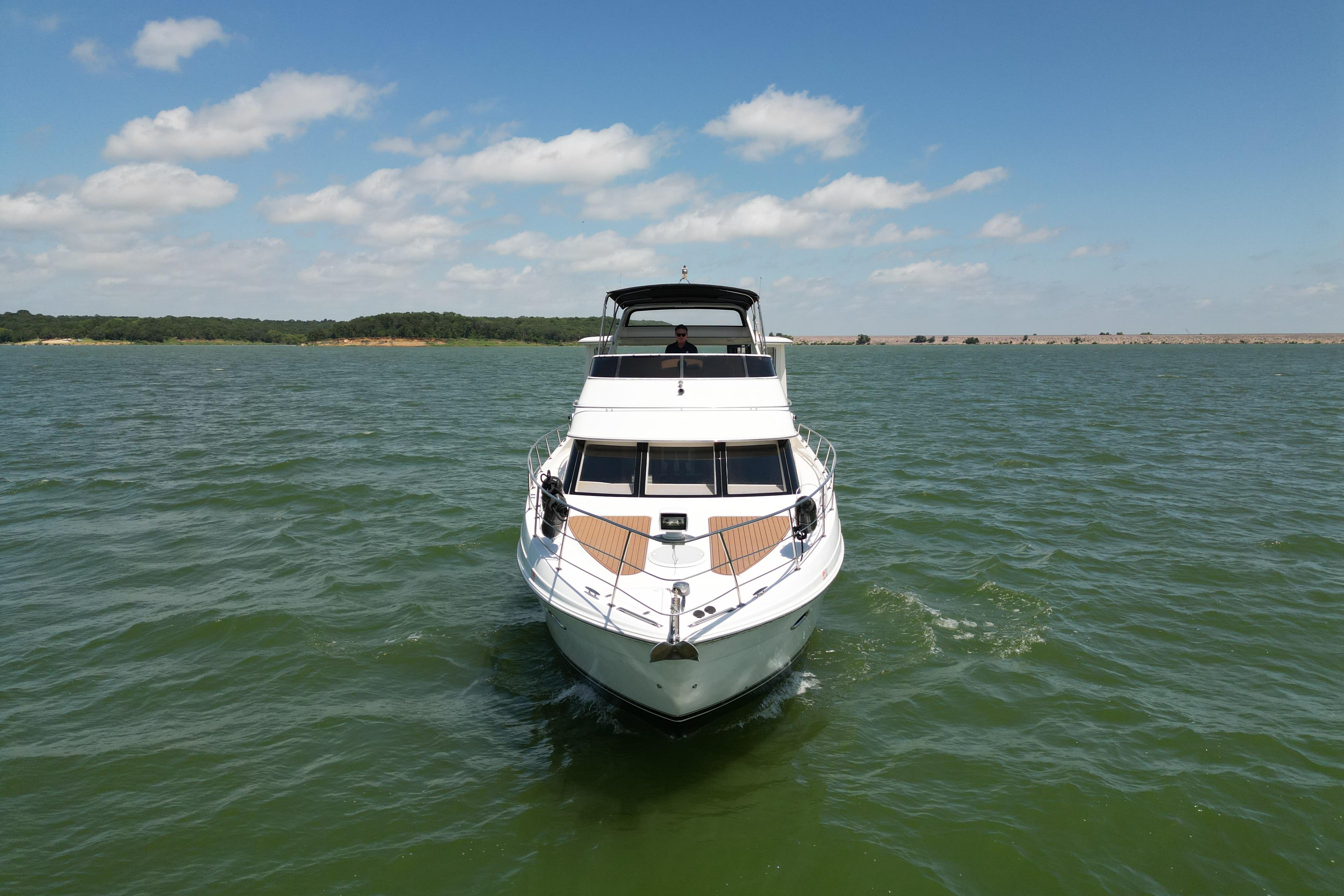 2002 Carver 396 Motor Yacht cruising on a sunny day with clear skies.