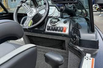 2020 Lund 1875 Pro-V Sport boat dashboard with steering wheel and control panel.