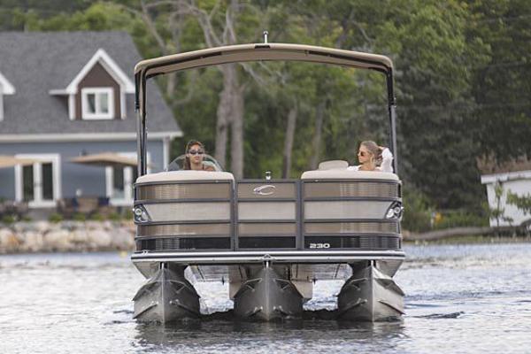 Manufacturer Provided Image: 2021 Crest Caribbean LX 250 SLS pontoon boat on a lake with two people.