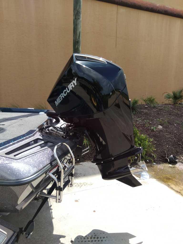 2025 Ranger Z518 boat with Mercury outboard motor, parked outdoors.