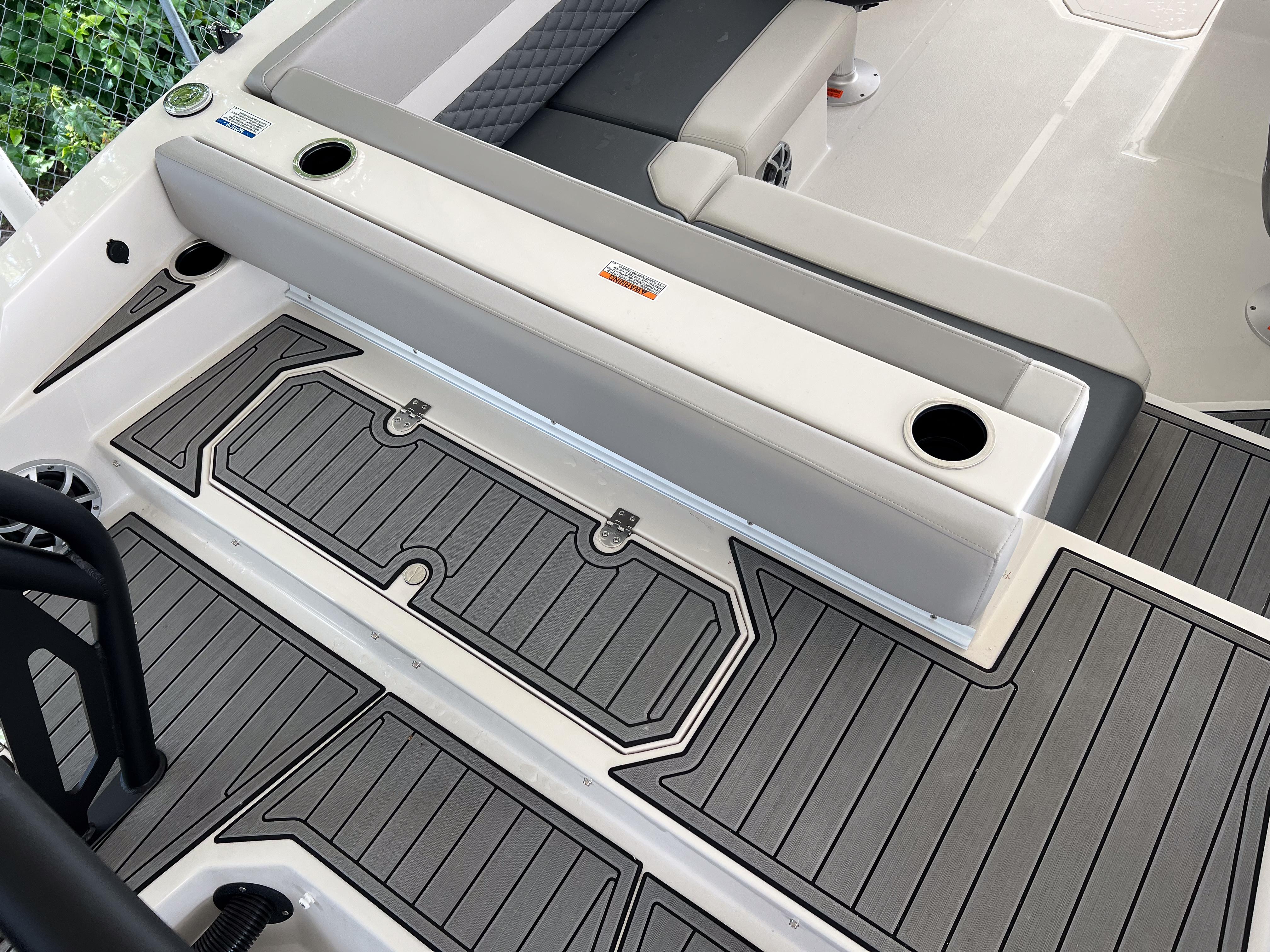 2026 Starcraft SVX 231 OB boat interior with gray seating and non-slip flooring.