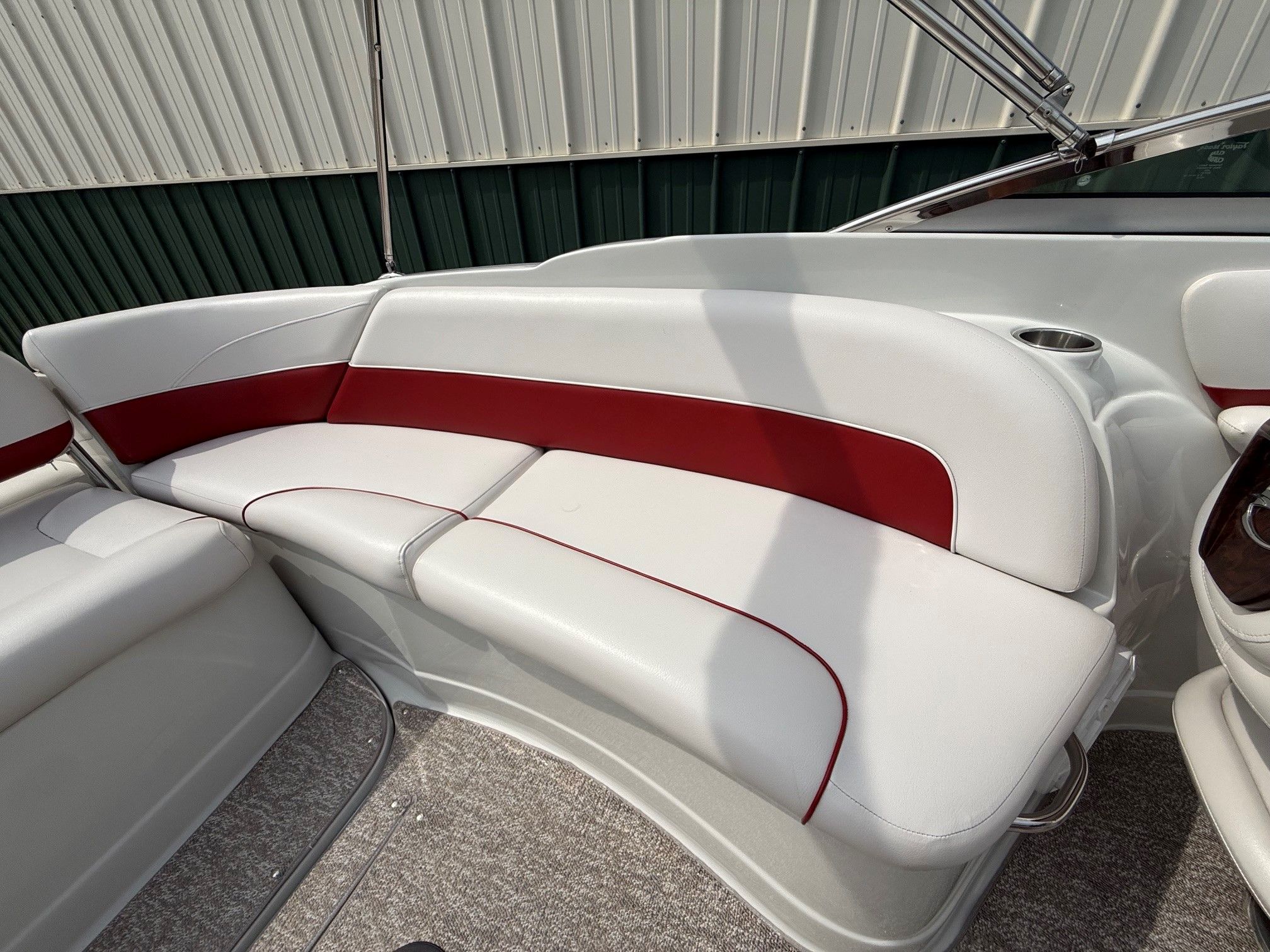Interior of a 2012 Crownline 252 EX with white and red seating.