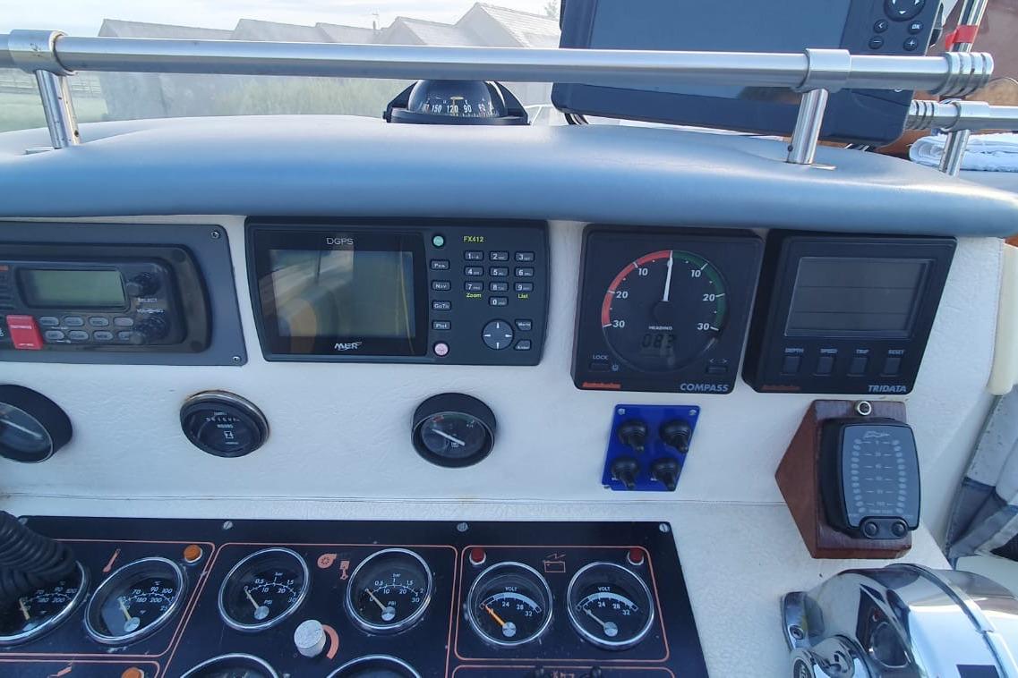 Control panel of a 1989 Fairey Spearfish MKIII boat with various gauges and instruments.