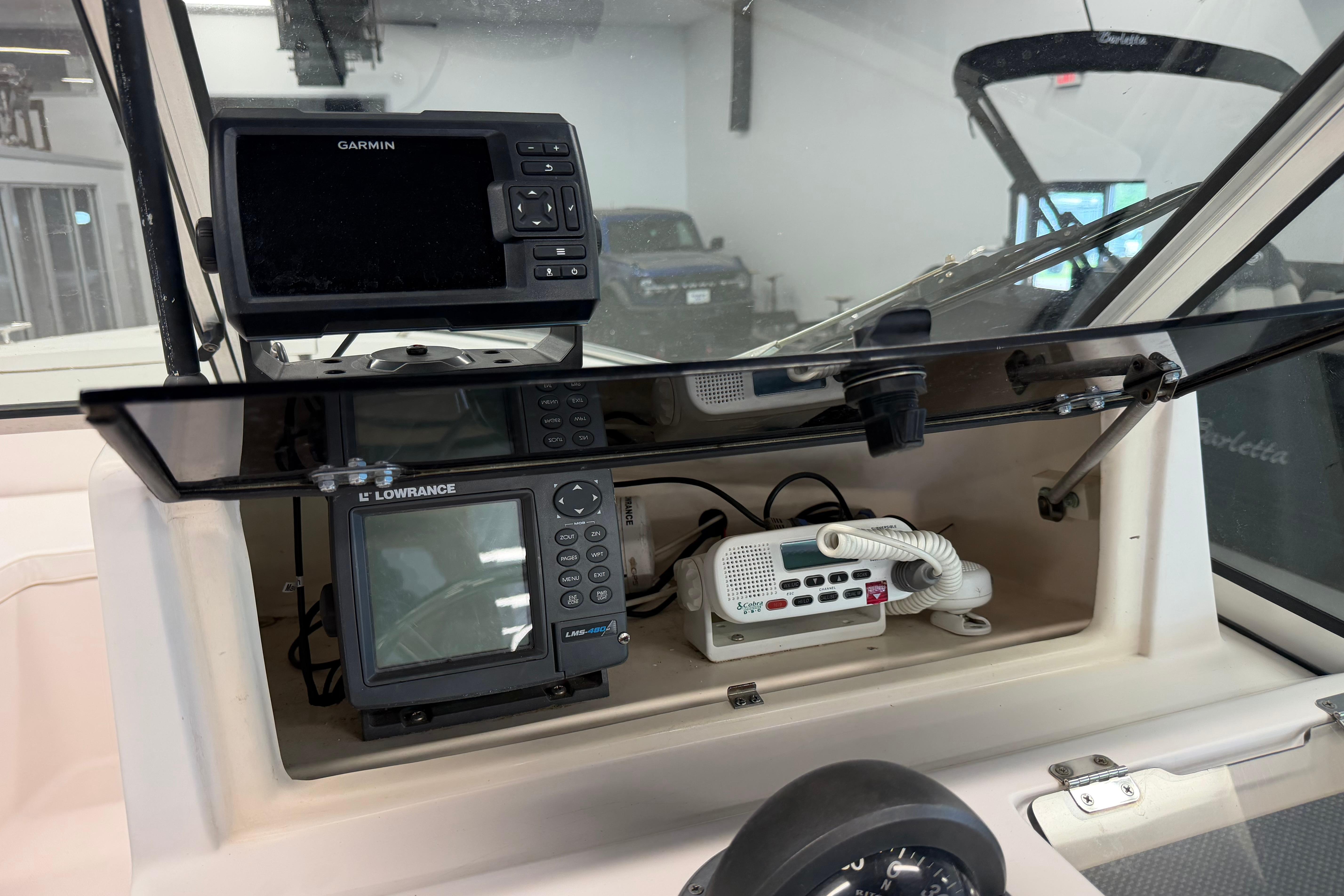 2001 Grady-White Tournament 223 dashboard with Garmin and Lowrance electronics.