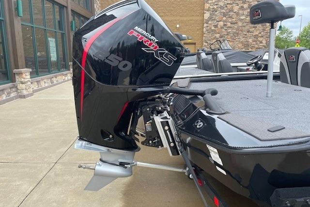 2025 Ranger ALPHA 208 boat with Mercury Pro XS 50 engine, docked outdoors.