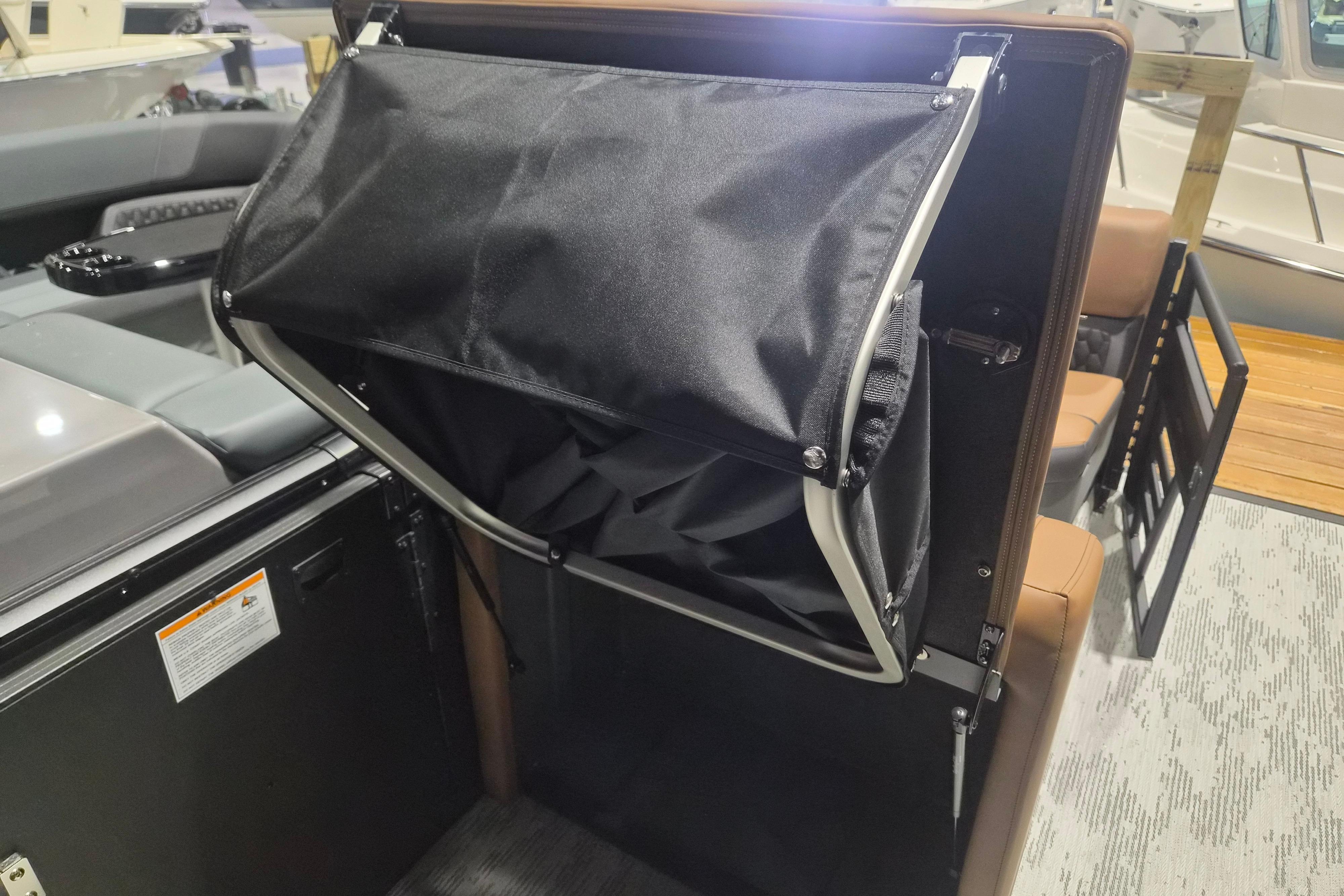 2026 Sylvan L3 SLZ boat interior with foldable storage compartment.