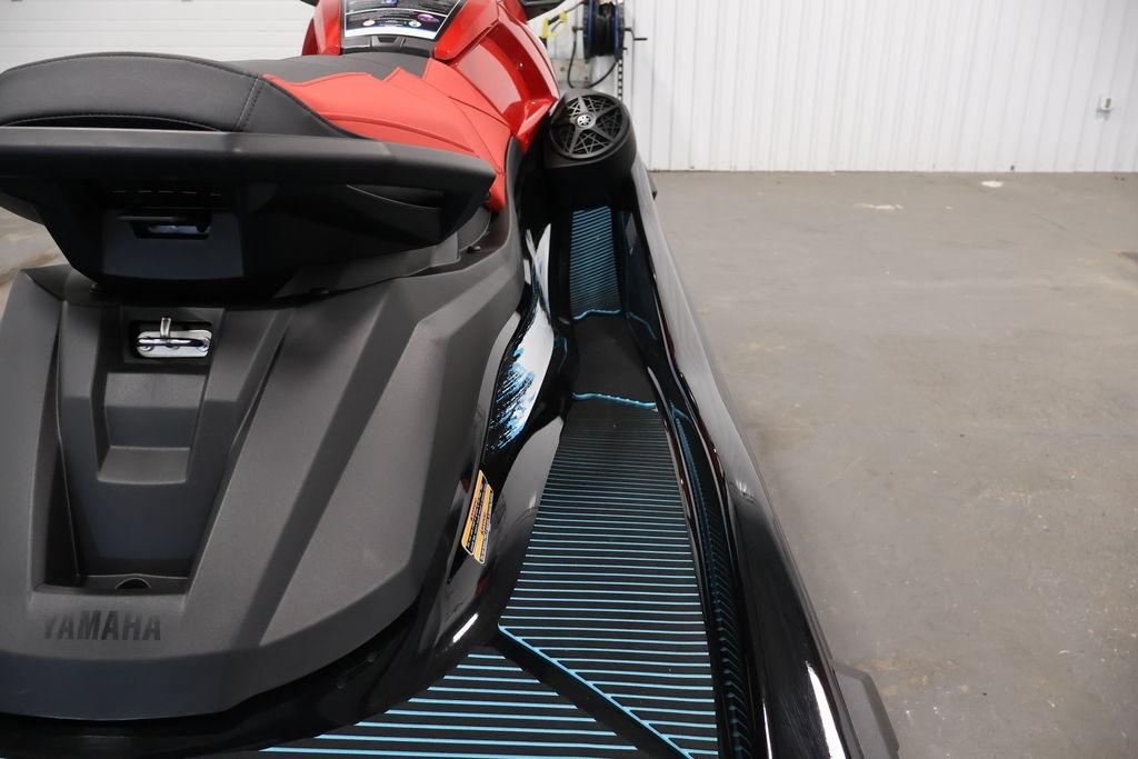 2026 Yamaha WaveRunner VX Deluxe with sleek design and red seat in a garage setting.