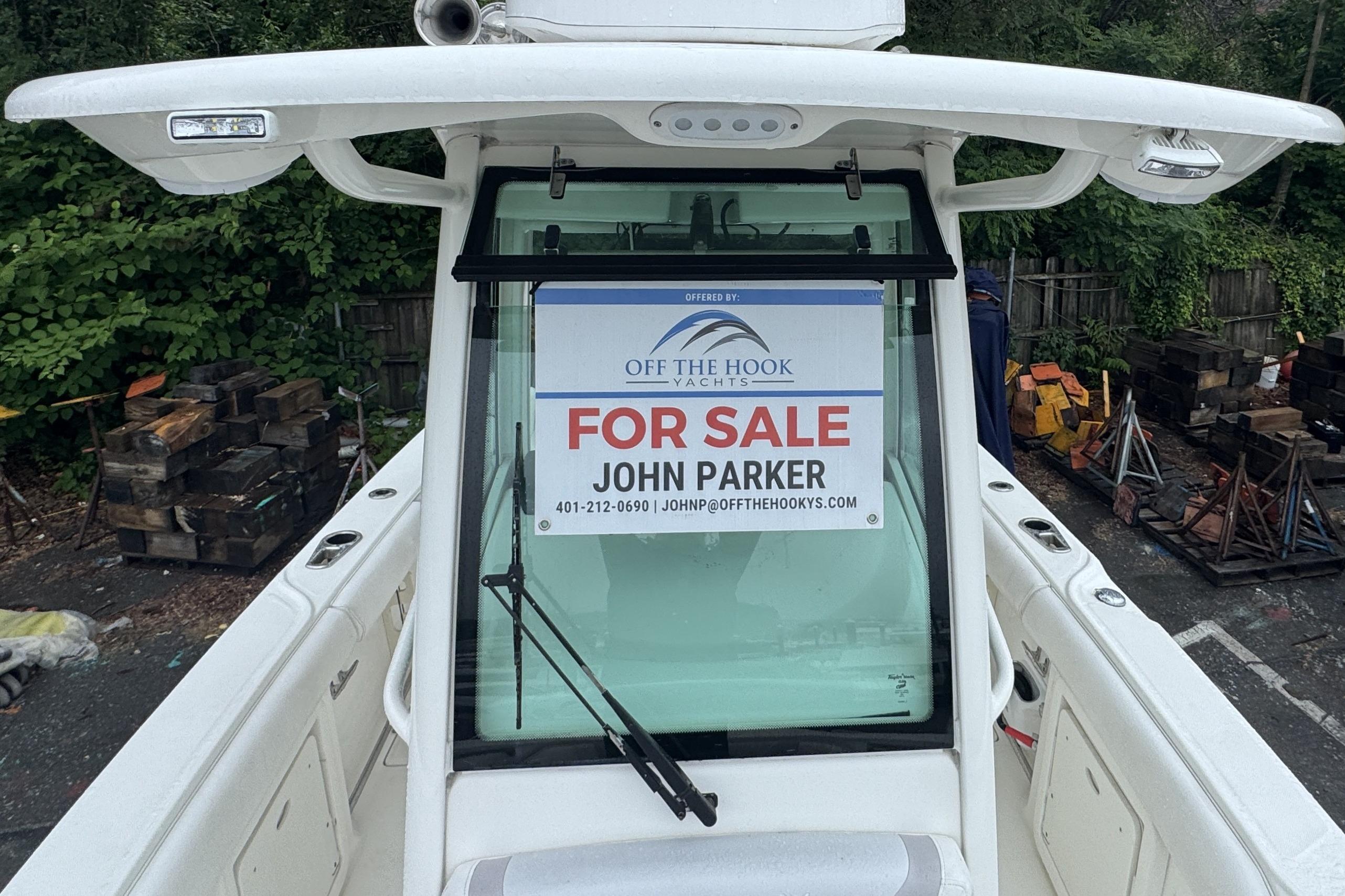2014 Boston Whaler 250 Outrage boat for sale, displayed with contact information.
