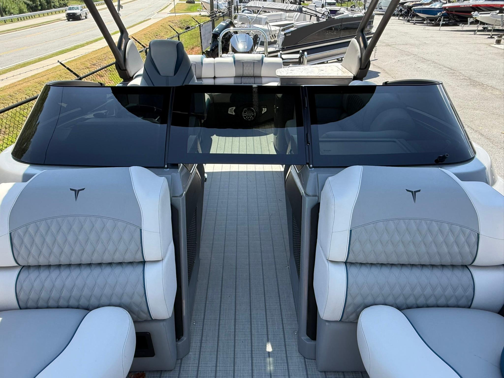 2025 Tahoe Pontoon Grand Tahoe Elite Windshield with luxurious seating and sleek design.