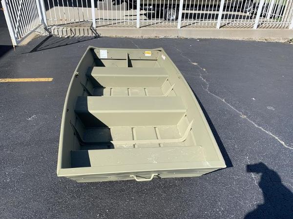 2024 Lowe L1040 Jon boat on pavement, featuring a simple, durable design.