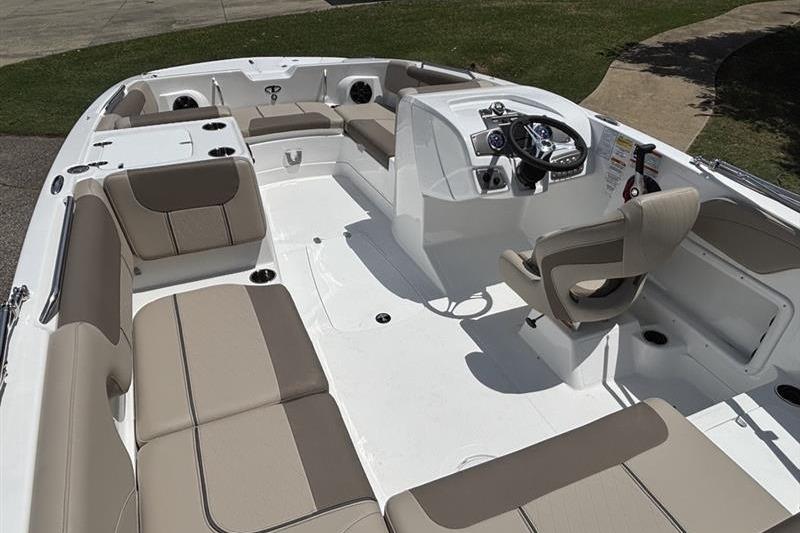 2026 Tahoe 2150 boat interior with beige seating and modern steering console.