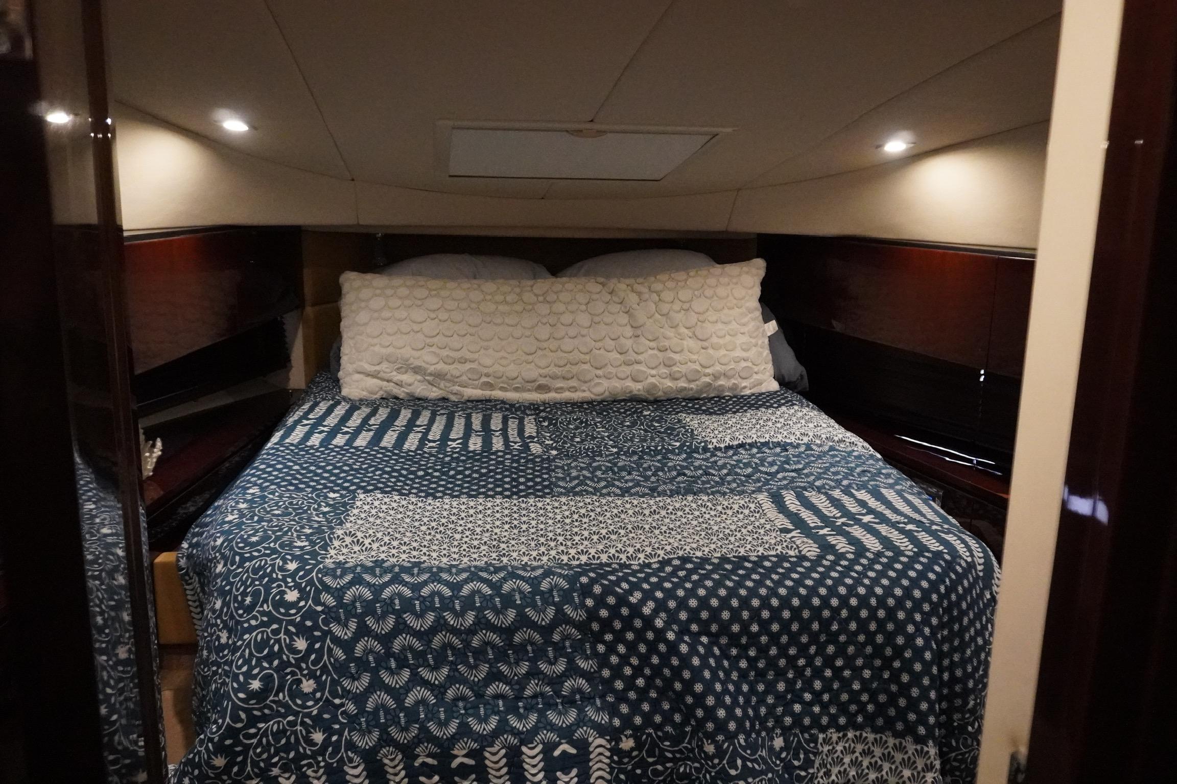 Luxurious bedroom interior of 2009 Sea Ray 47 Sedan Bridge yacht.