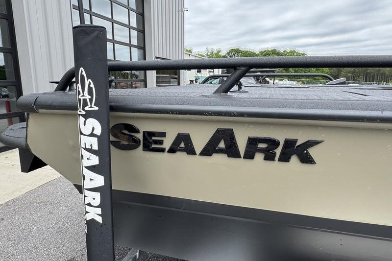 2026 SeaArk Predator 300 AK boat exterior with logo, parked near a building.