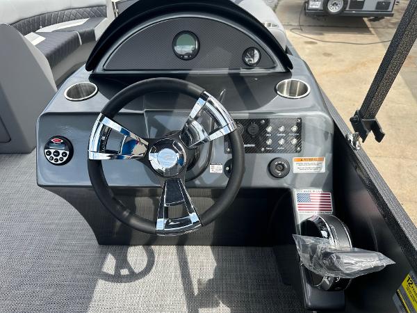 2024 Massimo Marine P-21R boat dashboard with steering wheel and control panel.