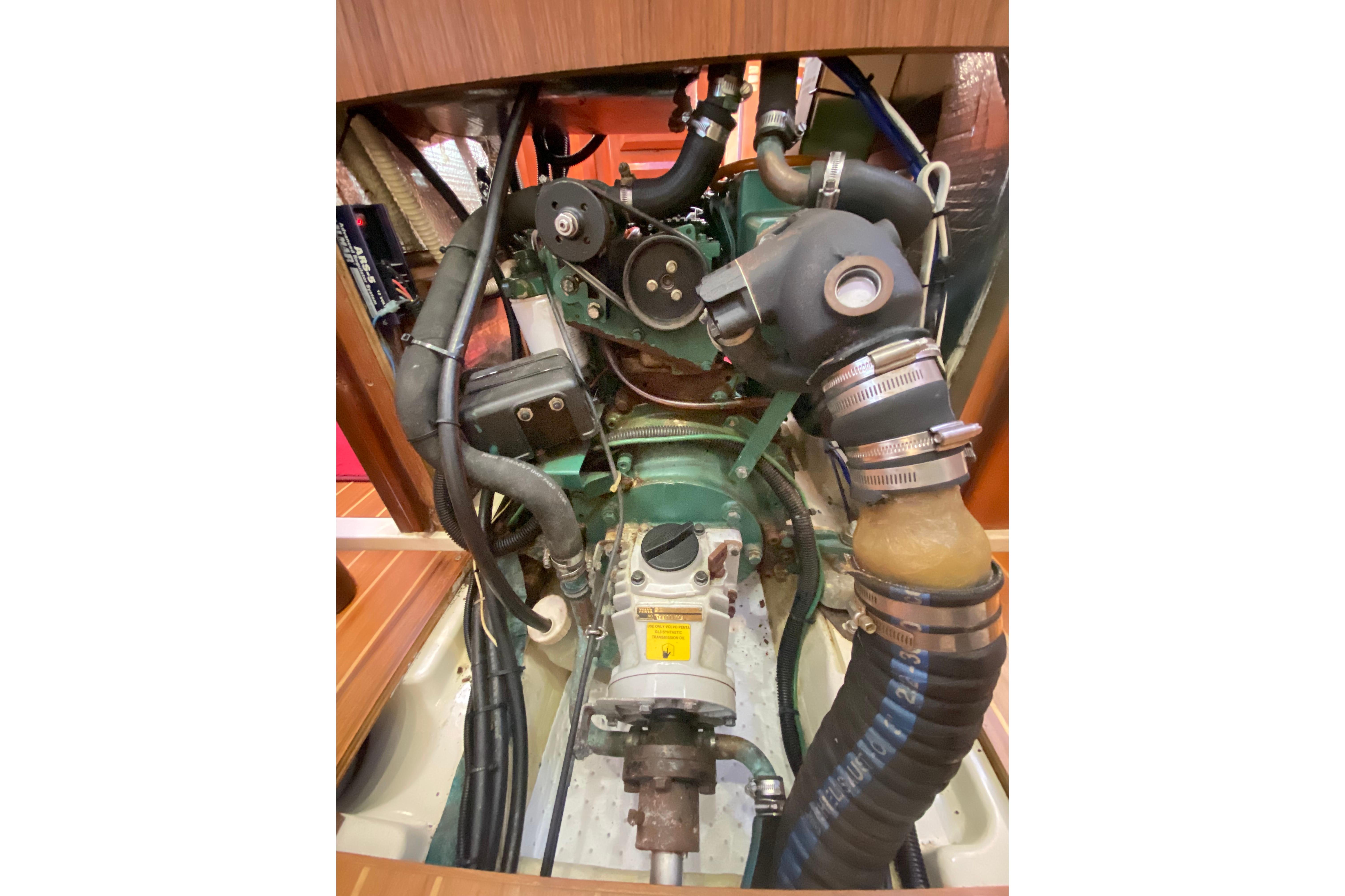 Engine compartment of a 1997 Hunter Legend 40.5 sailboat, showcasing mechanical components.
