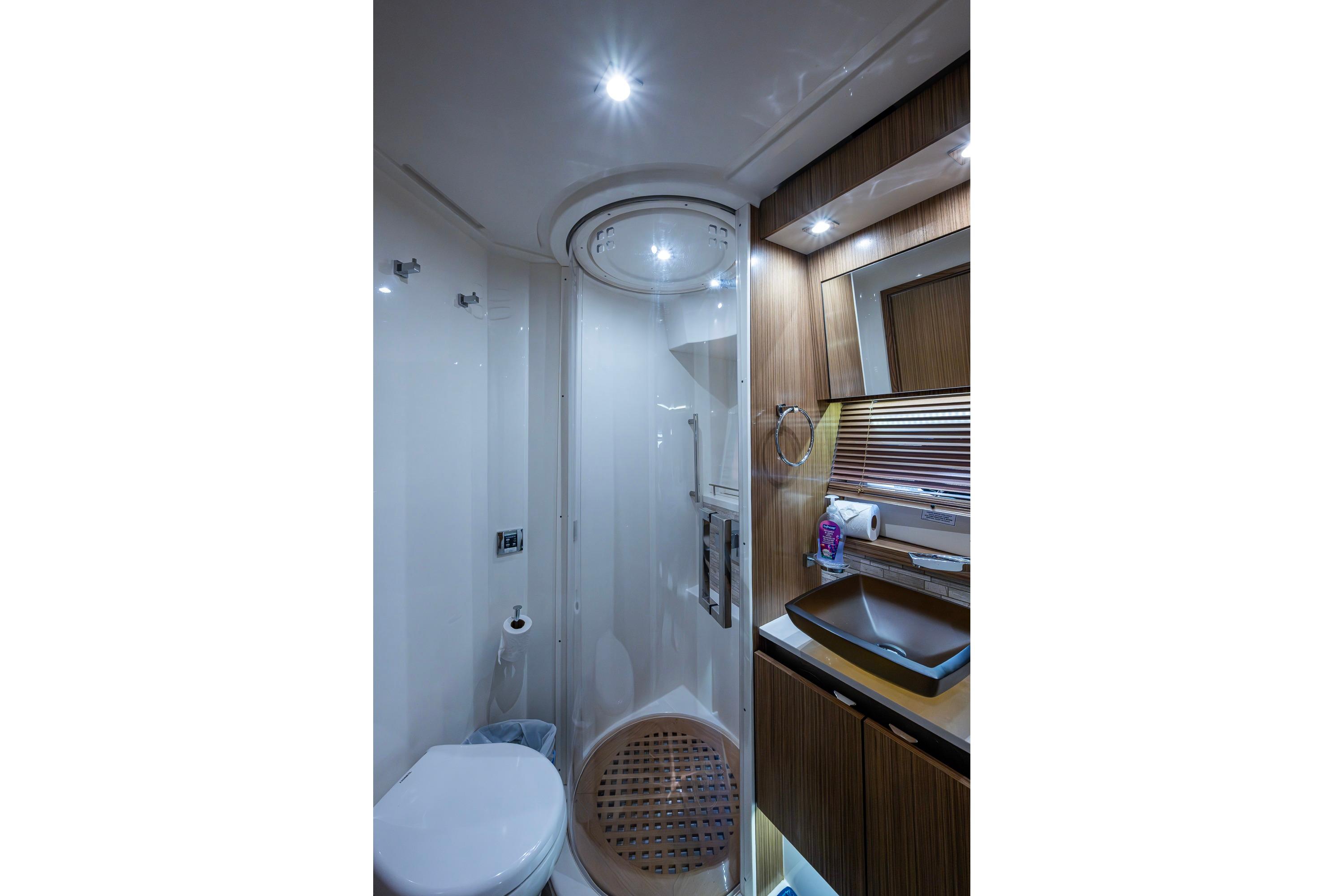 Luxurious bathroom in 2018 Sea Ray L550 Fly yacht with modern fixtures and elegant design.