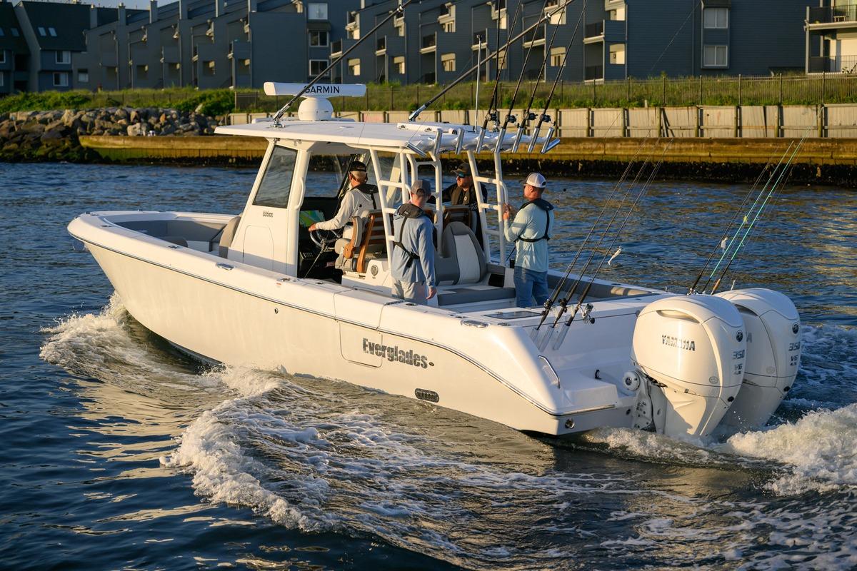 2026 Everglades 335 Center Console boat cruising with anglers on board.